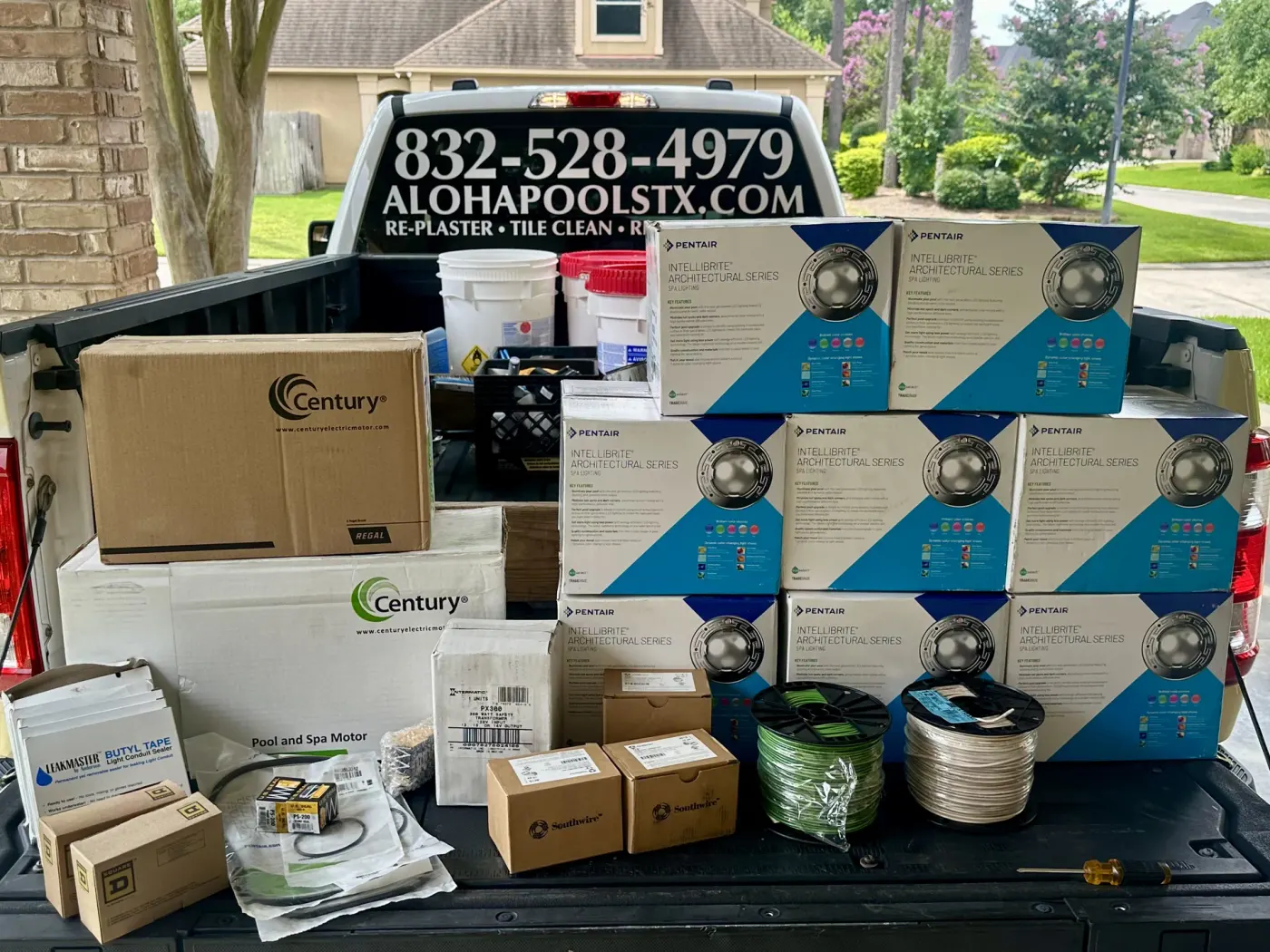 Aloha pickup truck loaded with Pentair IntelliBrite LED pool light boxes and Century pump motors